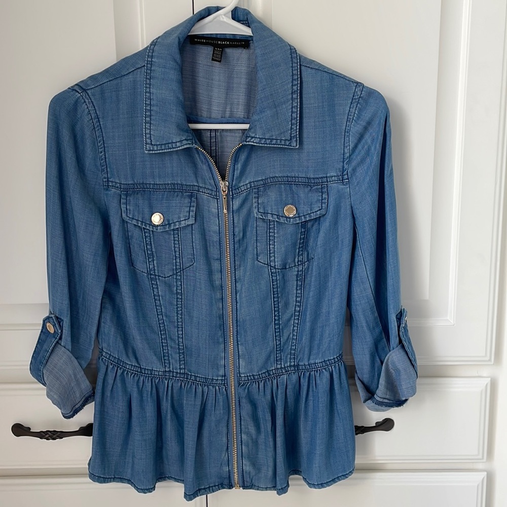 Light denim WHBM blouse with zipper, roll tan sleeves, pockets, and peplum.
